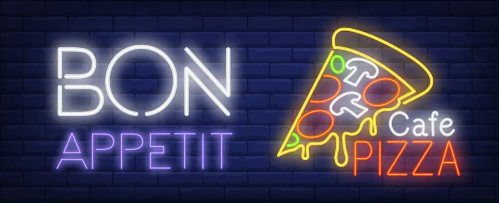 Design trends for restaurants: Bon appetite Cafe pizza neon sign. Pizza slice with melted cheese on dark blue brick wall. Night bright advertisement. Vector illustration in neon style for restaurant and pizza house